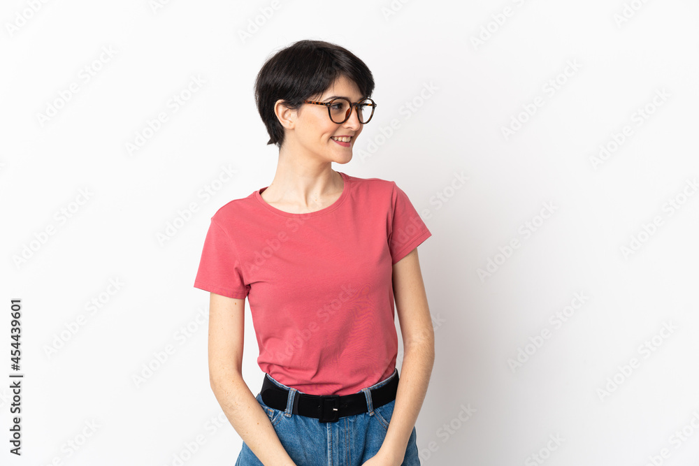 Woman with short hair isolated on white background looking to the side and smiling Woman with short hair isolated on white background looking to the side and smiling