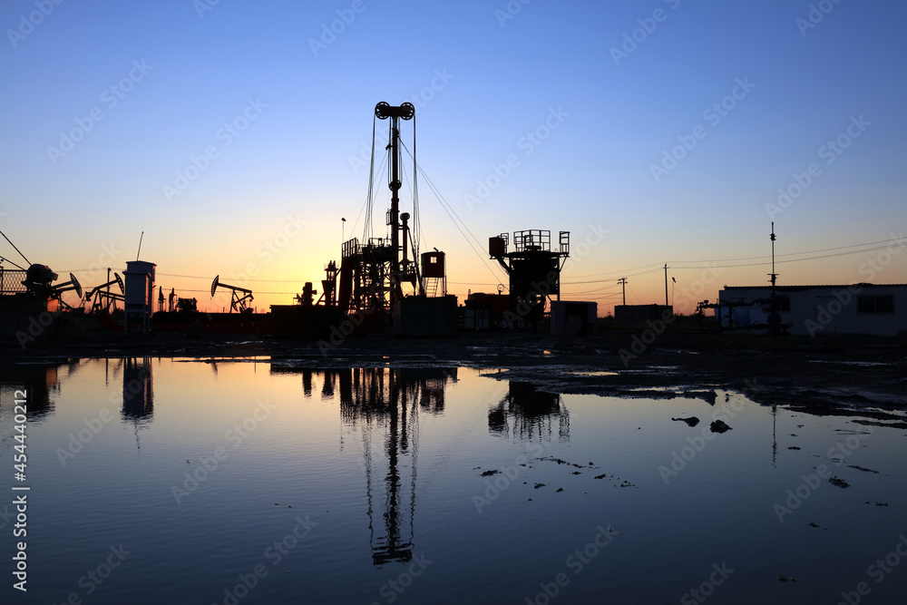 In the evening, oil field site under construction