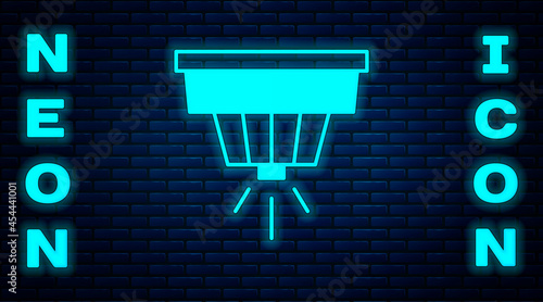 Glowing neon Smoke alarm system icon isolated on brick wall background. Smoke detector. Vector