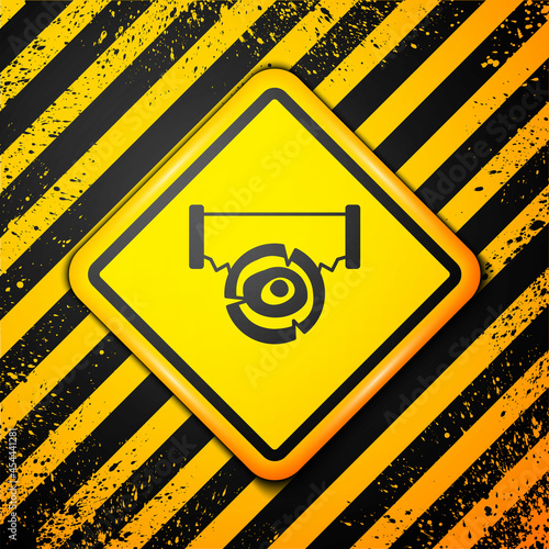 Black Two-handed saw and log icon isolated on yellow background. Warning sign. Vector