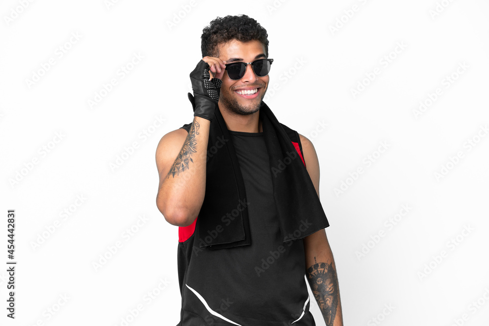 Sport brazilian man with towel isolated on white background with glasses and happy Sport brazilian man with towel isolated on white background with glasses and happy