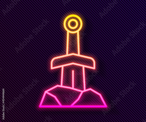 Glowing neon line Sword in the stone icon isolated on black background. Excalibur the sword in the stone from the Arthurian legends. Vector