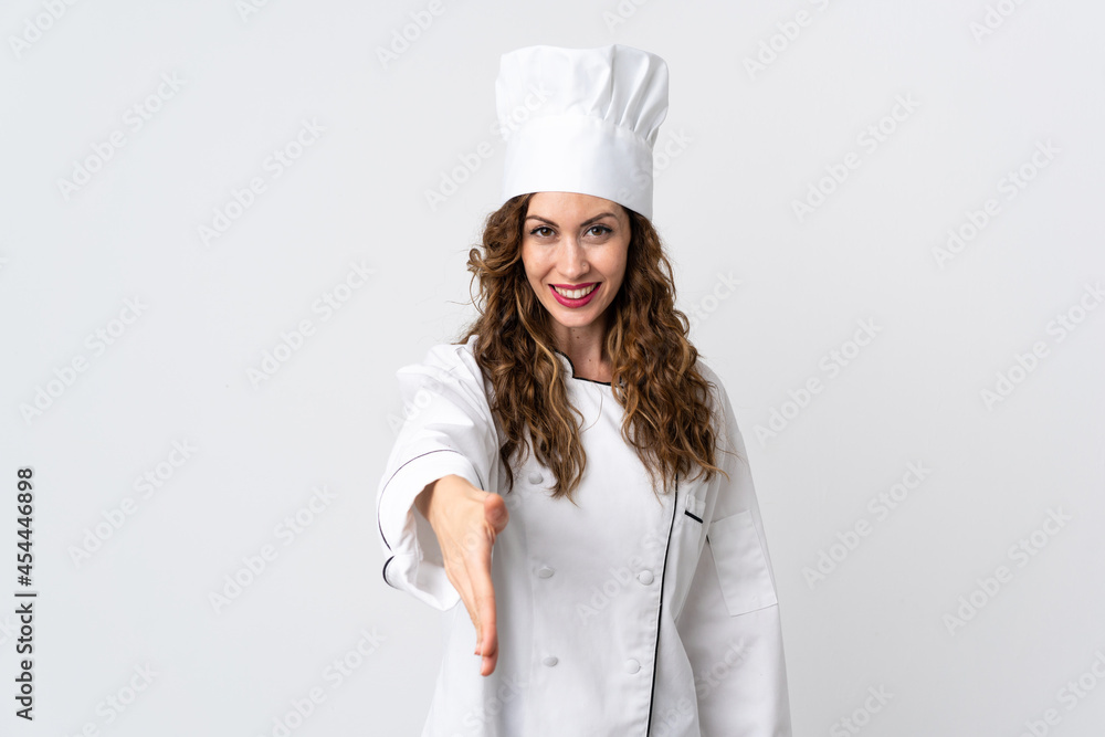 Young chef woman isolated on white background shaking hands for closing a good deal Young chef woman isolated on white background shaking hands for closing a good deal