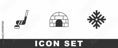 Set Ice hockey stick and puck, Igloo ice house and Snowflake icon. Vector