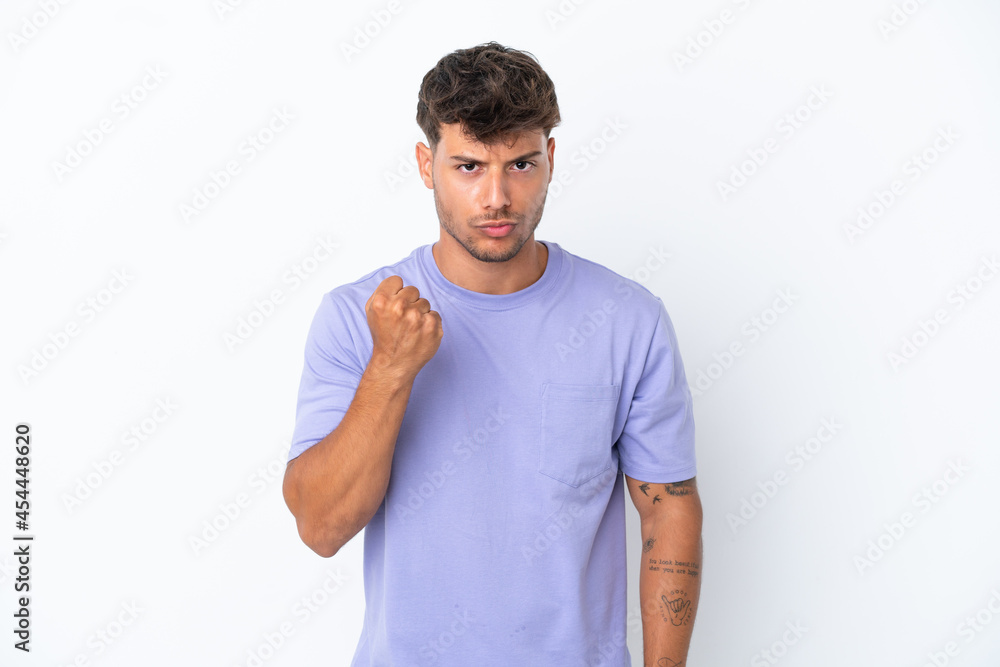 Young caucasian handsome man isolated on white background with unhappy expression Young caucasian handsome man isolated on white background with unhappy expression