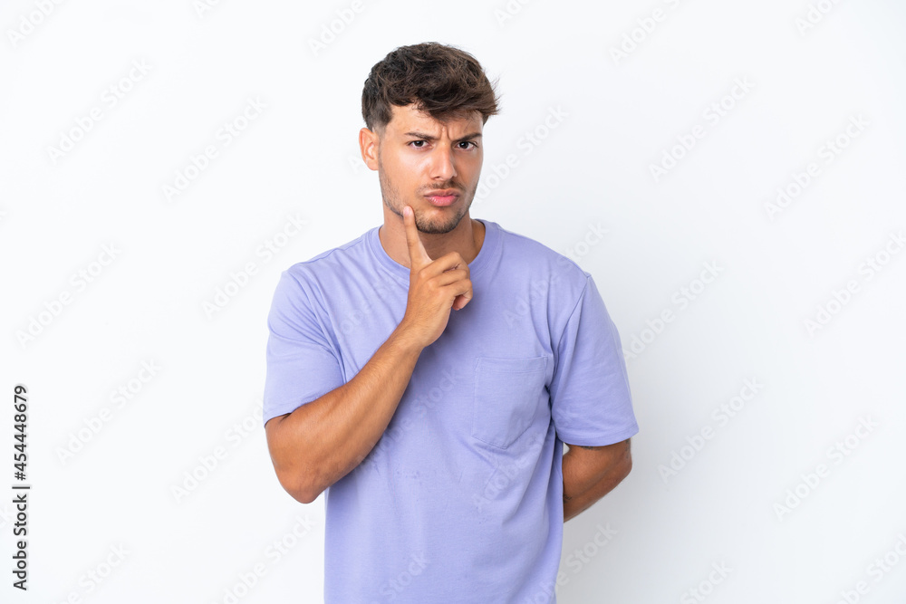 Young caucasian handsome man isolated on white background and thinking Young caucasian handsome man isolated on white background and thinking