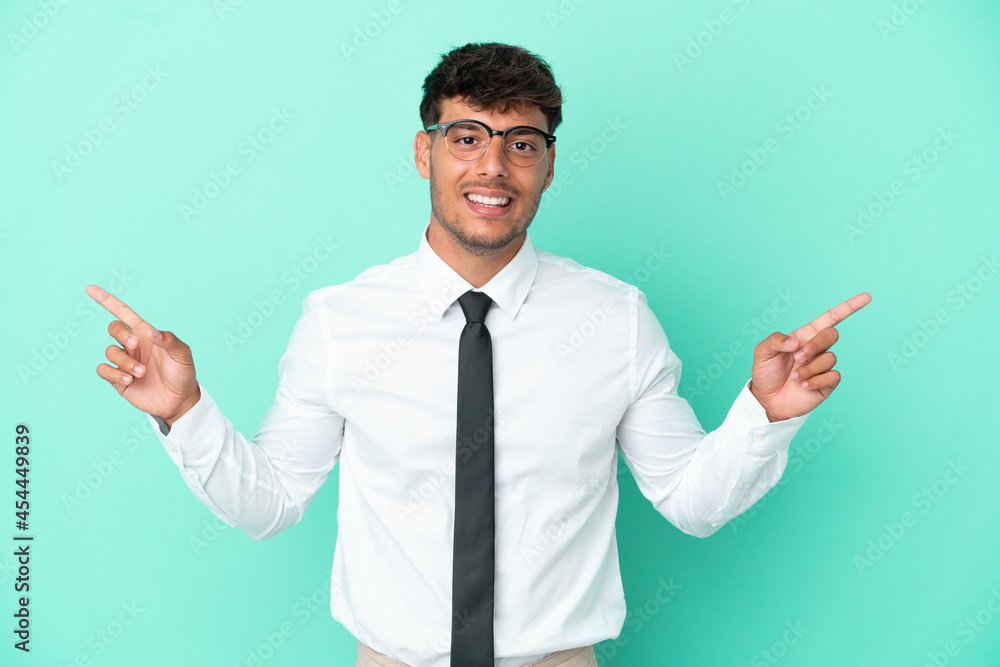Business caucasian man isolated on blue background pointing finger to the laterals and happy Business caucasian man isolated on blue background pointing finger to the laterals and happy