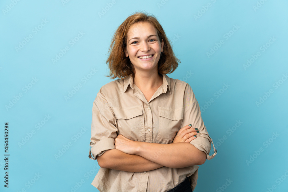 Young Georgian woman isolated on blue background keeping the arms crossed in frontal position Young Georgian woman isolated on blue background keeping the arms crossed in frontal position