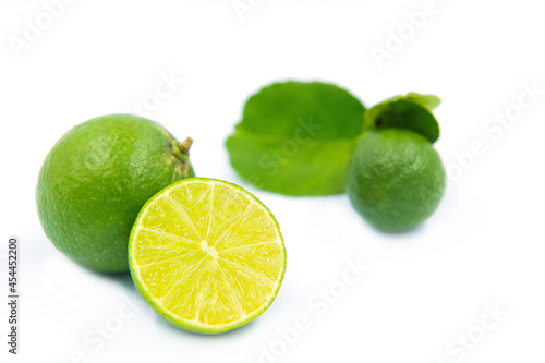 green lemons on white background
