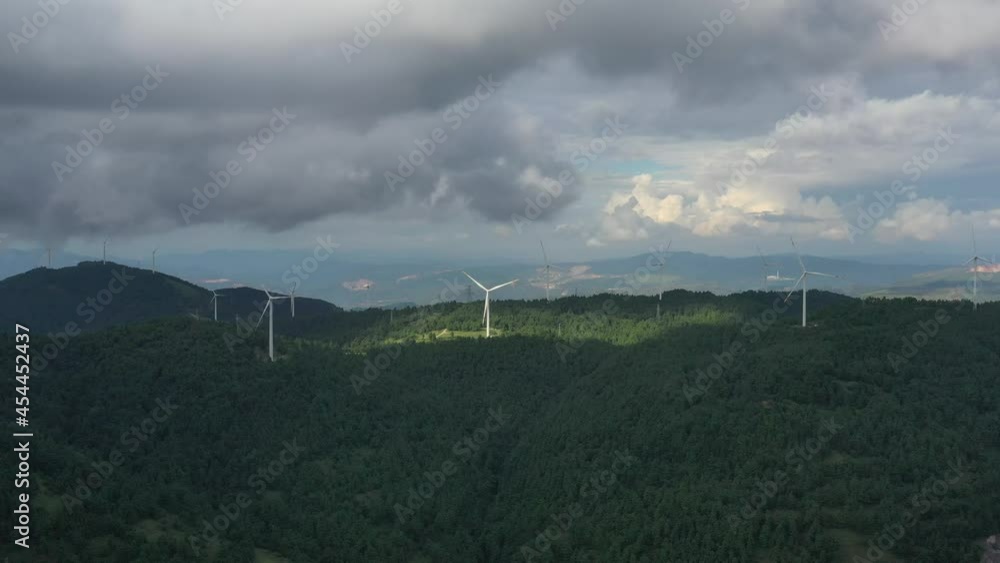 clouds over the mountains with windmill clouds over the mountains with windmill