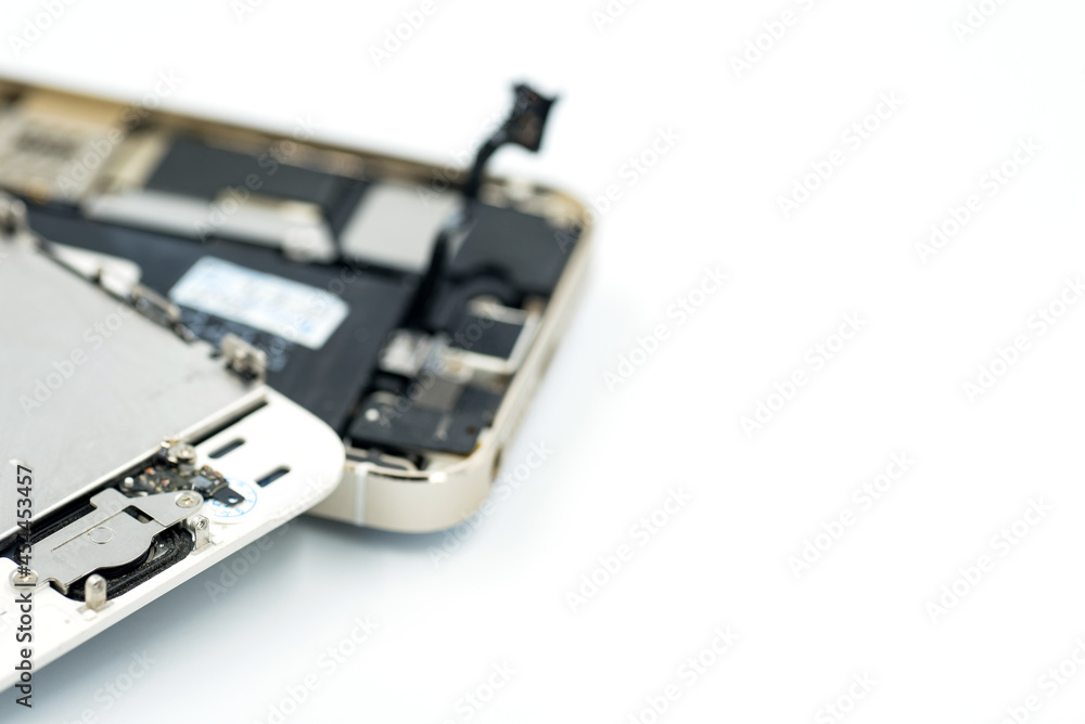 Broken phone, spares, battery is dead, cell phone on white background
Broken phone, spares, battery is dead, cell phone on white background