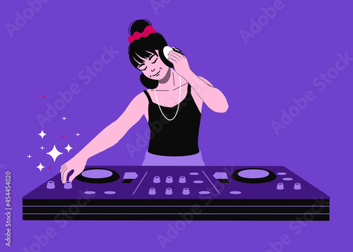 DJ with mixer live show. female DJ mixing music club party. Audio mixer song arrangement DJ with headphones making beats.