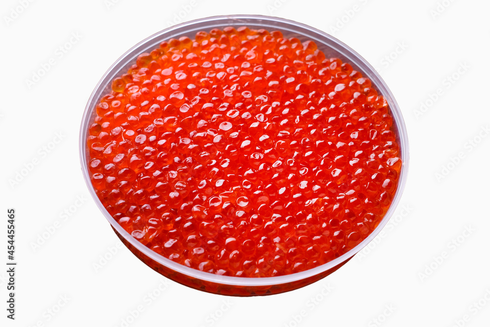 Fresh red caviar isolated on white. Closeup caviar in bowl Fresh red caviar isolated on white. Closeup caviar in bowl