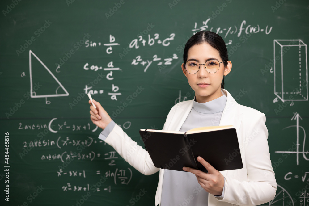 Young asian teacher woman teaching holding book and chalk video