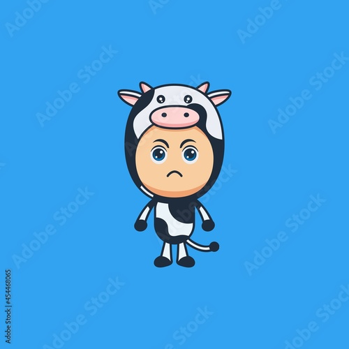 Cute cartoon angry boy wearing cow costume