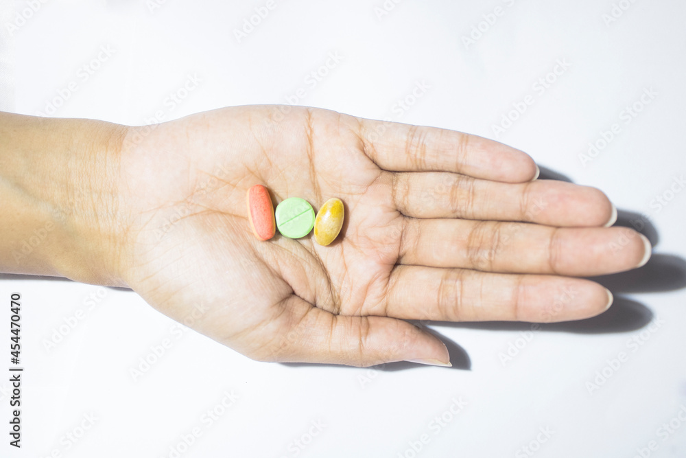 Top view of pills and medicine in hands and white background, Hands holding pills and medicine Top view of pills and medicine in hands and white background, Hands holding pills and medicine