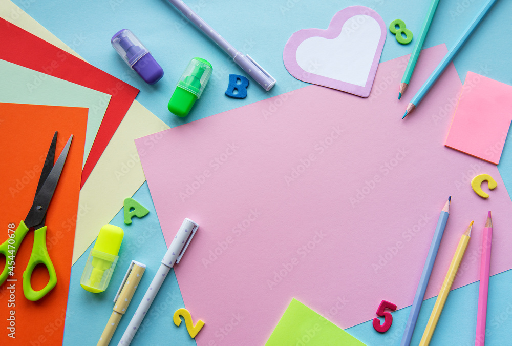 Frame of different stationery on blue background Frame of different stationery on blue background