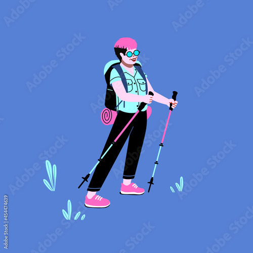 non binary person with hiking gear walking on trail. outdoor national park walk and camp