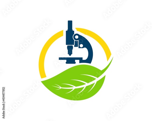 Green nature leaf with laboratory microscope on the top