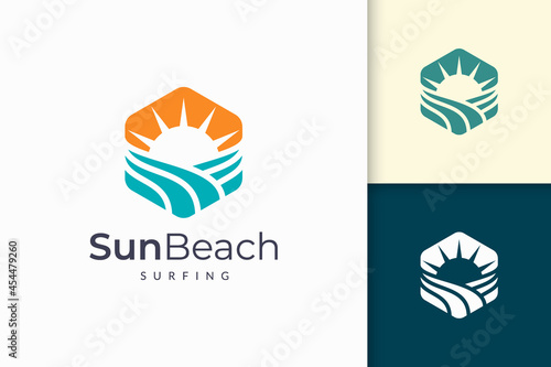 Ocean or sea logo in abstract water wave and sun represent adventure