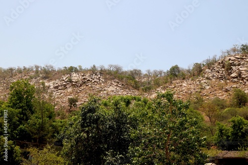 Image of small hill with big big rock