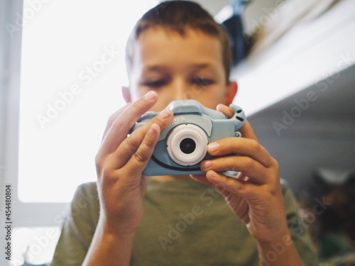  children play with a toy camera. take pictures
