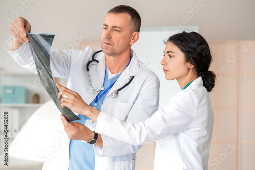 Medical professionals exami...