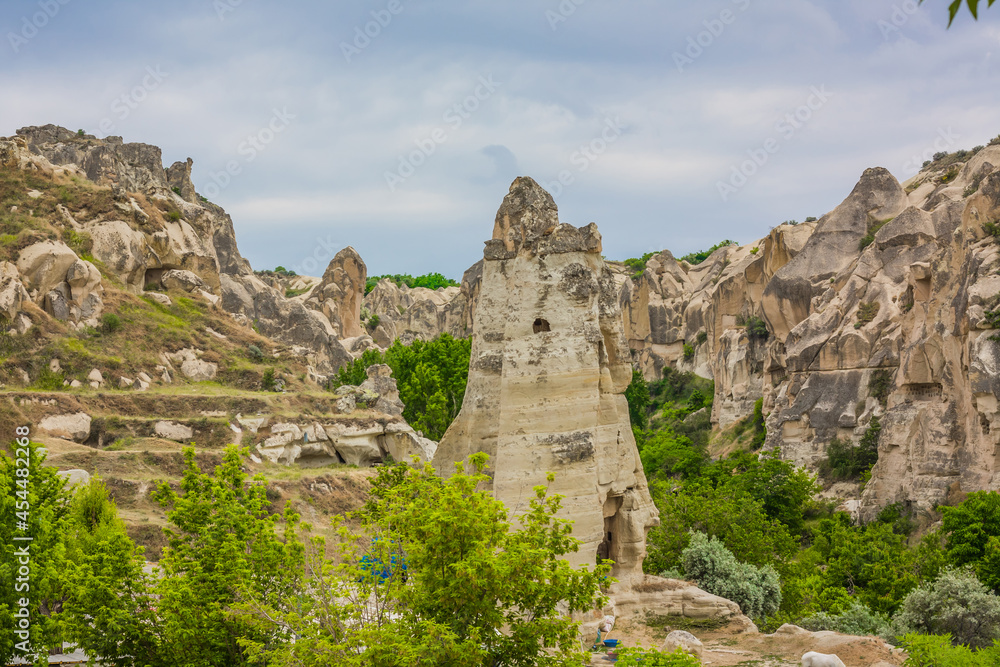 Amazing Volcanic rock formations known as Love Valley or Fairy Chimneys in Cappadocia, Turkey. Mushroom Valley one of attractions in Goreme National Park, Turkey. Mountains with rooms inside