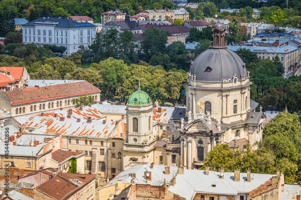 View of historical old city district of Lviv in cloudy morning, Ukraine. View of Dominican Church. Early autumn. Old buildings and courtyards in historic Lviv