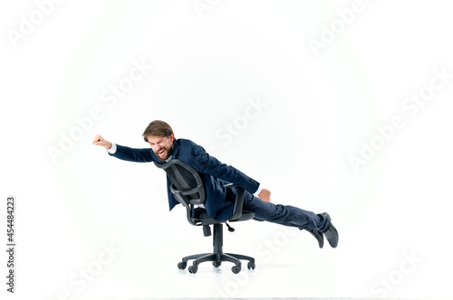 business man rolling in a chair entertainment work office
