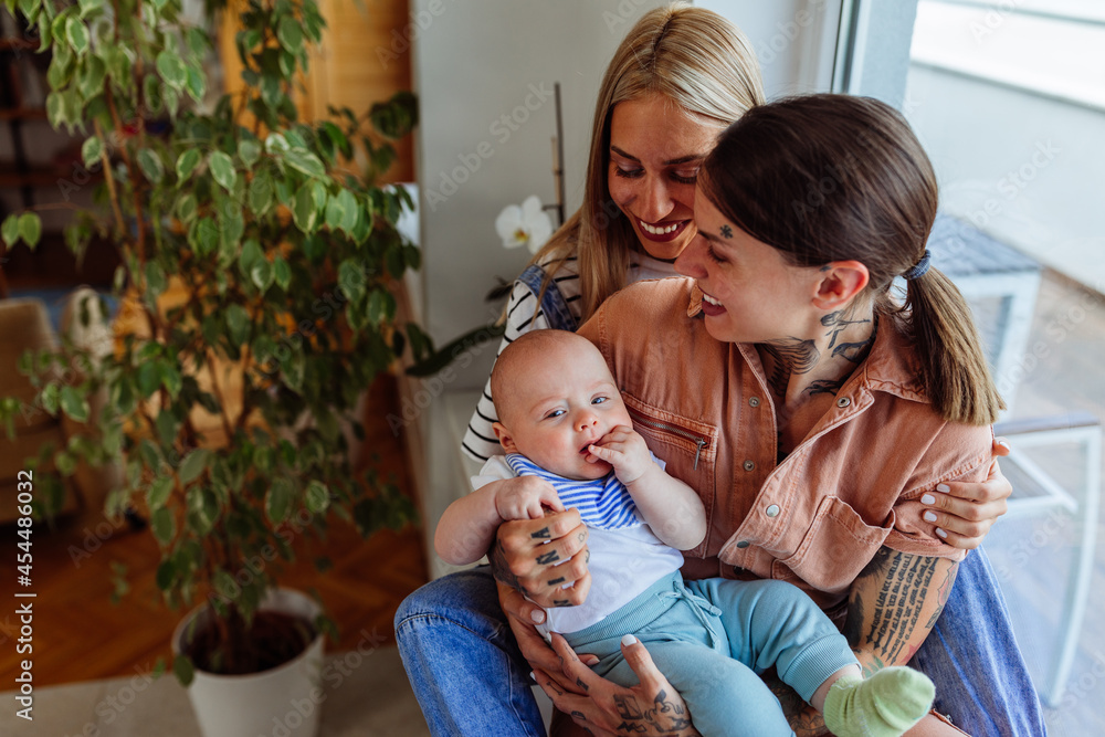 Two women smiling at an adorable baby Two women smiling at an adorable baby