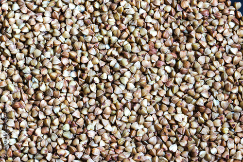Grain buckwheat, detail texture background, closeup of buckwheat background
