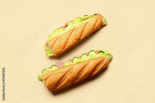 Tasty sandwiches on color b...