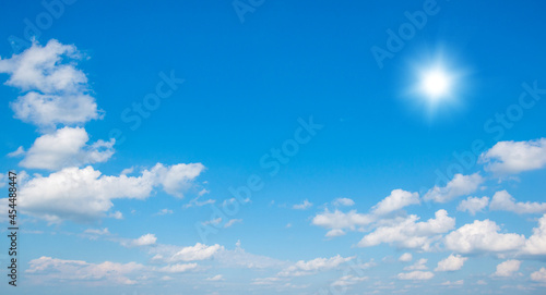 Fototapeta Naklejka Na Ścianę i Meble -  Blue sky with clouds and sun.