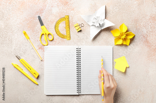 Woman with notebook and sta...