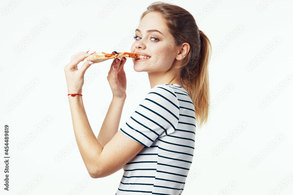 woman in striped t-shirt eating pizza fast food diet light background woman in striped t-shirt eating pizza fast food diet light background