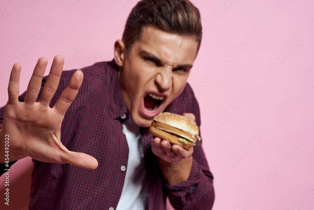 man in shirt eating hamburger snack restaurant man in shirt eating hamburger snack restaurant