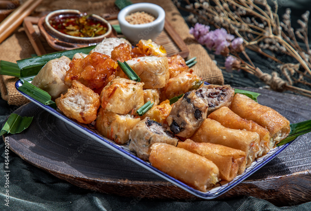 Many vegetarian food : Fried taro rolls (Taro Guangjian) and Deep fried spring rolls, Tofu, Radish, Taro and black beans (Zhu jiao quan or Fried taro cakes) With spicy sweet sauce, crushed peanuts. Many vegetarian food : Fried taro rolls (Taro Guangjian) and Deep fried spring rolls, Tofu, Radish, Taro and black beans (Zhu jiao quan or Fried taro cakes) With spicy sweet sauce, crushed peanuts.