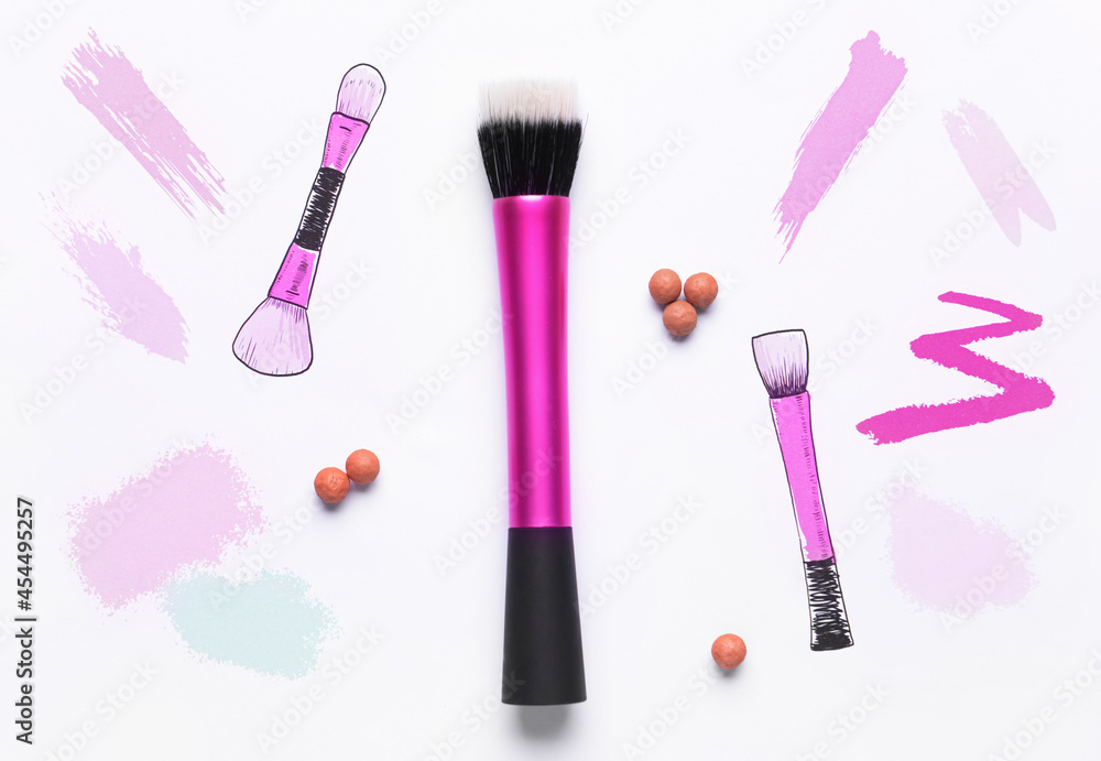 Makeup brush with powder and drawings on white background Makeup brush with powder and drawings on white background