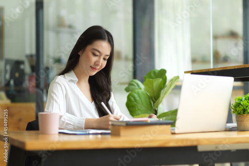 Pleased and Happy businesswoman working in office workplace