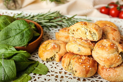Puff pastry stuffed with spinach and vegetables on tray