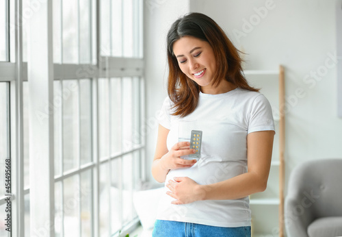 Young pregnant Asian woman ...