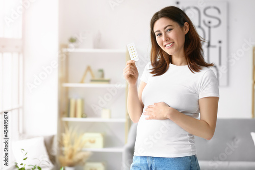 Young pregnant Asian woman ...