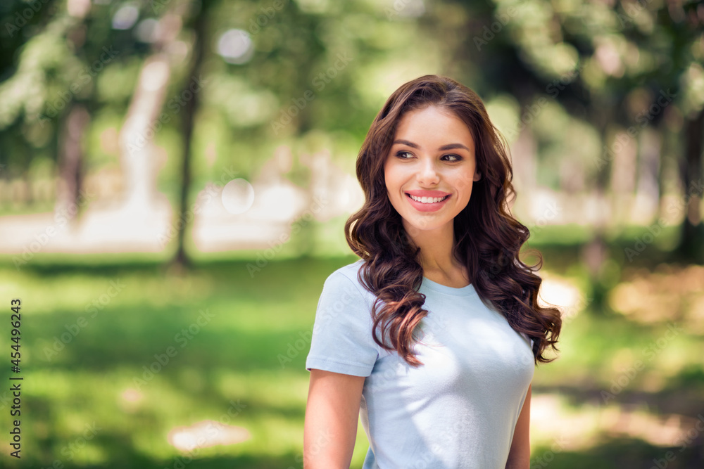 Photo of cheerful lovely dreamy happy positive young woman smile weekend enjoy nature outside outdoors park Photo of cheerful lovely dreamy happy positive young woman smile weekend enjoy nature outside outdoors park