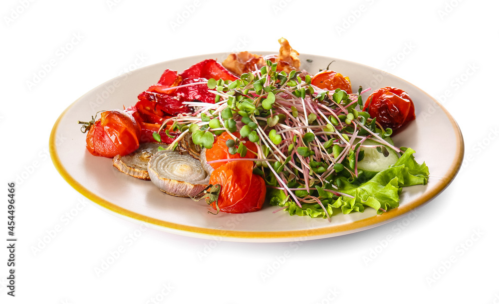 Plate of tasty salad with vegetables and micro green on white background