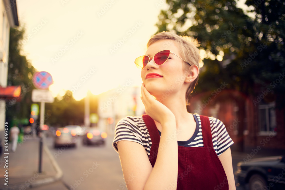 woman wearing sunglasses outdoors walk posing fashion