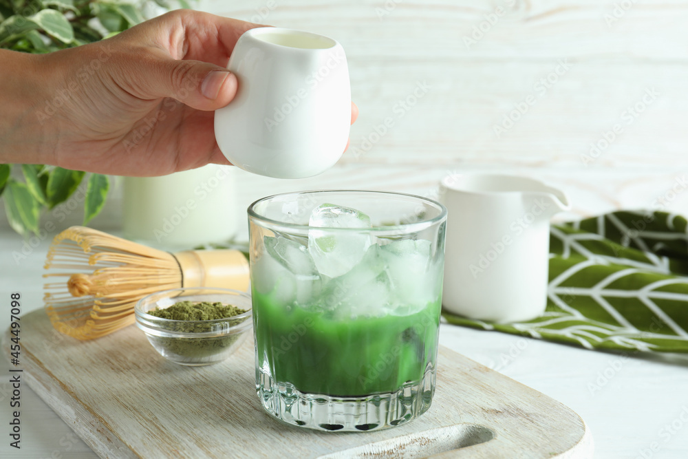 Concept of making matcha latte, close up Concept of making matcha latte, close up