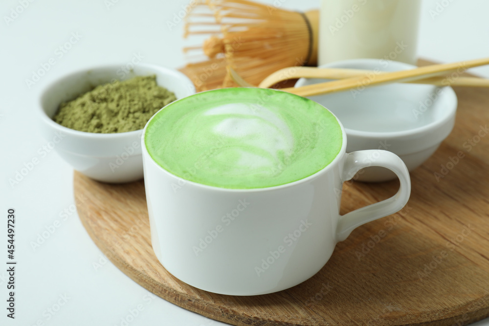 Matcha latte and accessories for making on white background Matcha latte and accessories for making on white background