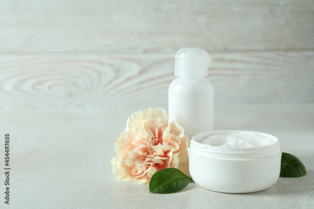 Natural spa cosmetics on white textured table Natural spa cosmetics on white textured table