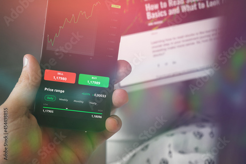 Stock trading graph chart on mobile phone screen. Financial manager concept background photo